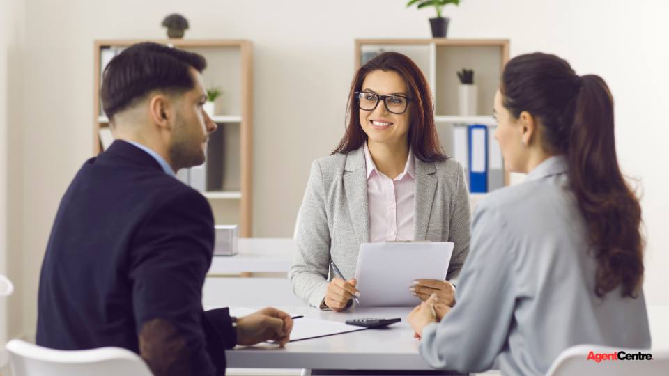 A buyers agent discussing family home options with a couple